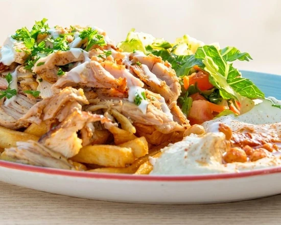 Chicken shawarma platter with garlic sauce, pickles and rice from Yafa Café in Winnipeg, MB